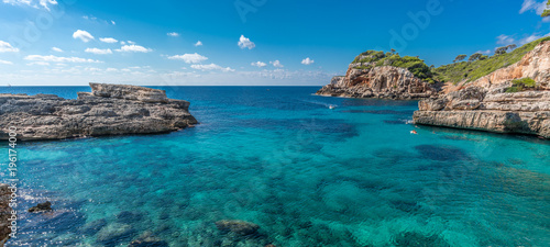 Wallpaper Mural Panoramic view of crystalline turquoise waters of Cala s'Almunia beach from cap des moro. Located in Santanyi, Majorca, Balearic Islands, Spain. Torontodigital.ca