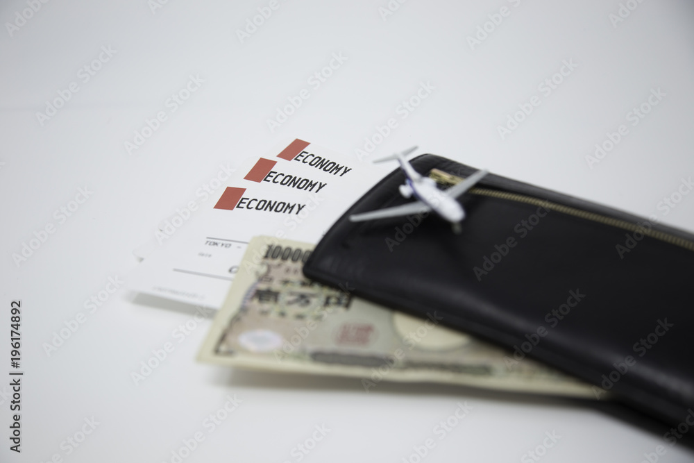 plane ticket and Japanese money plane ticket and Japanese money