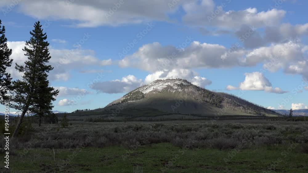 Isolated volcanic cone of Bunsen Peak in Yellowstone National Park. Wyoming, USA Isolated volcanic cone of Bunsen Peak in Yellowstone National Park. Wyoming, USA