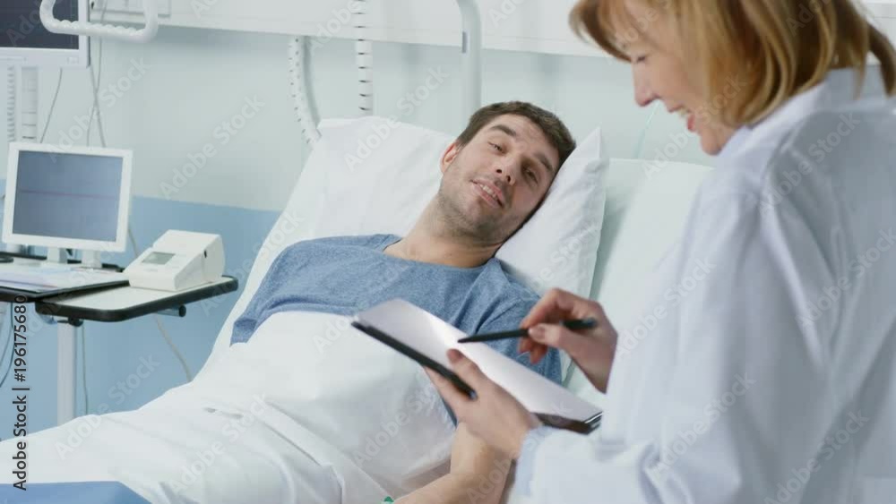 Professional Female Doctor Visit Male Patient who is Lying in Bed, She Asks Him Questions, Uses Tablet Computer to Fill Medical Chart. Friendly Health Care Shot on RED EPIC-W 8K Helium Cinema Camera. Professional Female Doctor Visit Male Patient who is Lying in Bed, She Asks Him Questions, Uses Tablet Computer to Fill Medical Chart. Friendly Health Care Shot on RED EPIC-W 8K Helium Cinema Camera.