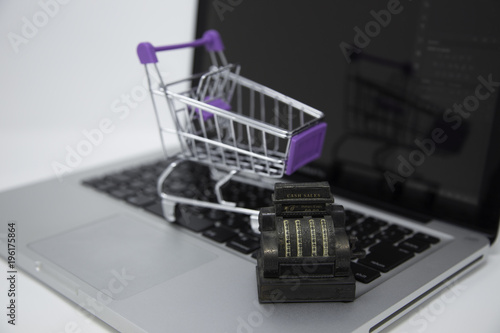 supermarket cart and laptop