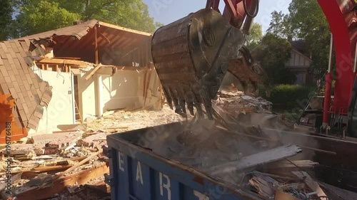 Excavator Bucket Unloading in Dumpster