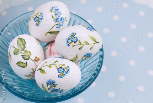 Easter Eggs with floral pattern on the blue polka dot background