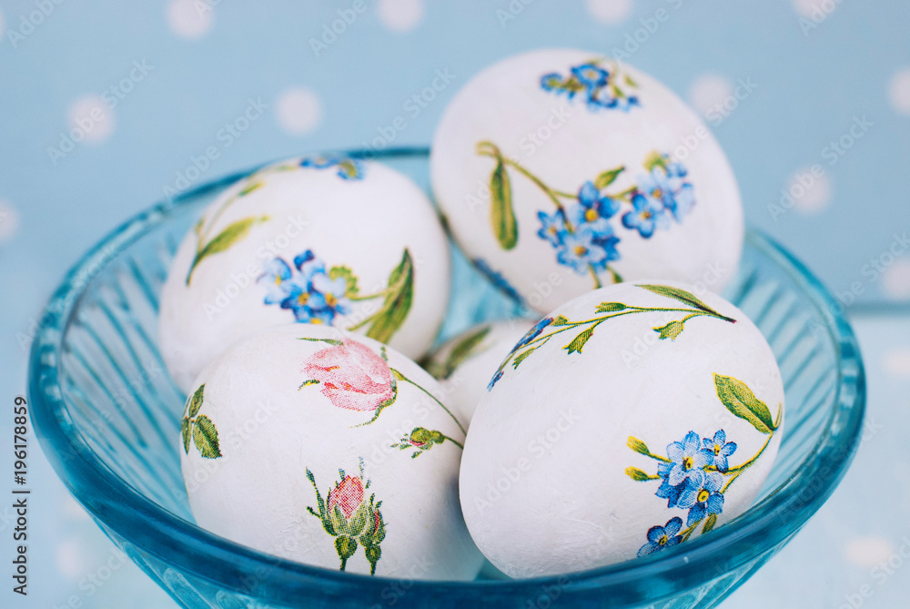 Easter Eggs with floral pattern on the blue polka dot background