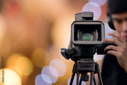 Camera Operator recording event with video camera
