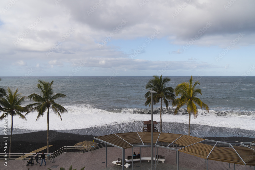 Naklejka premium A stormy day with big waves at the beach of Puerto Naos at La Palma west coast / Canary Islands