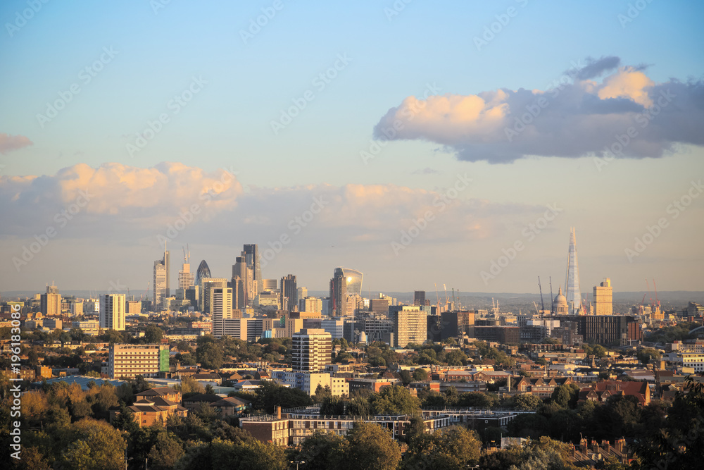 View towards London city skyline at sunset from Parliament Hill in Hampstead Heath