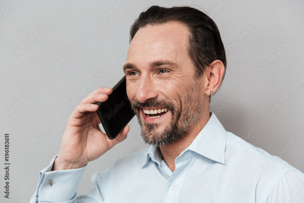 Close up portrait of a cheerful mature man Close up portrait of a cheerful mature man