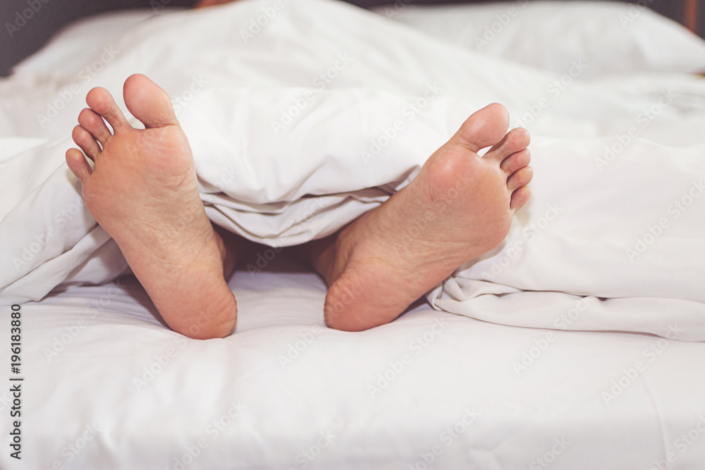 Woman on the bed at home with their feet showing Woman on the bed at home with their feet showing