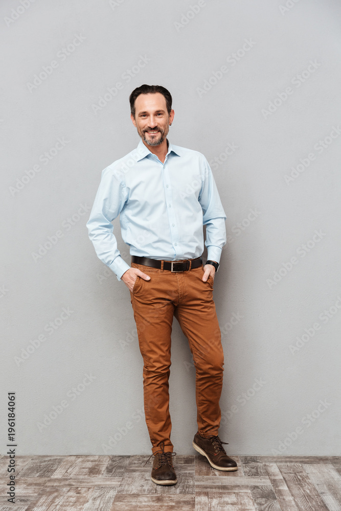 Fototapeta premium Full length portrait of a smiling mature man