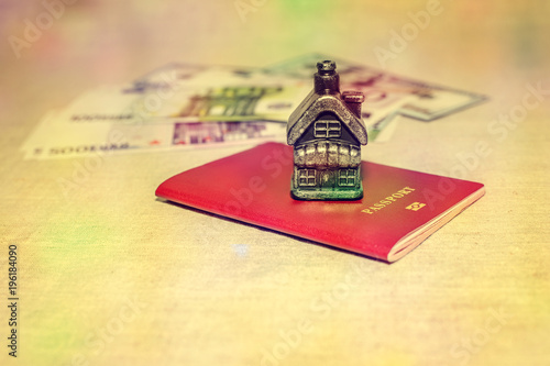 Passport, money and home - the concept of buying a property photo