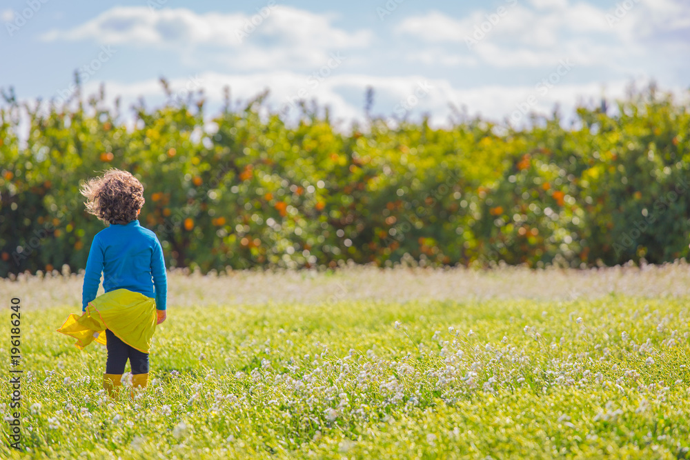 Little girl on spring green field Little girl on spring green field
