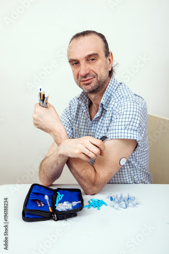 Wallpaper Mural sensor diabetes checkup glucose man system sugar monitoring scan test hand skin medicine syringe table white background Torontodigital.ca