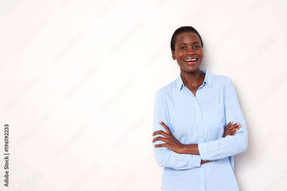 attractive african woman standing with arms crossed against white background attractive african woman standing with arms crossed against white background