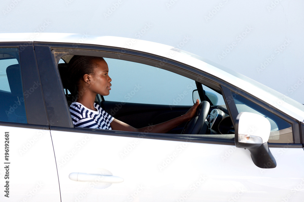 Naklejka premium young african woman driving car
