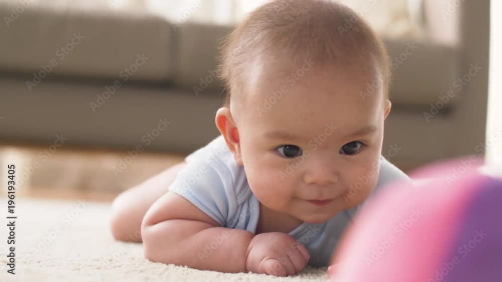 sweet little asian baby boy playing with toy sweet little asian baby boy playing with toy