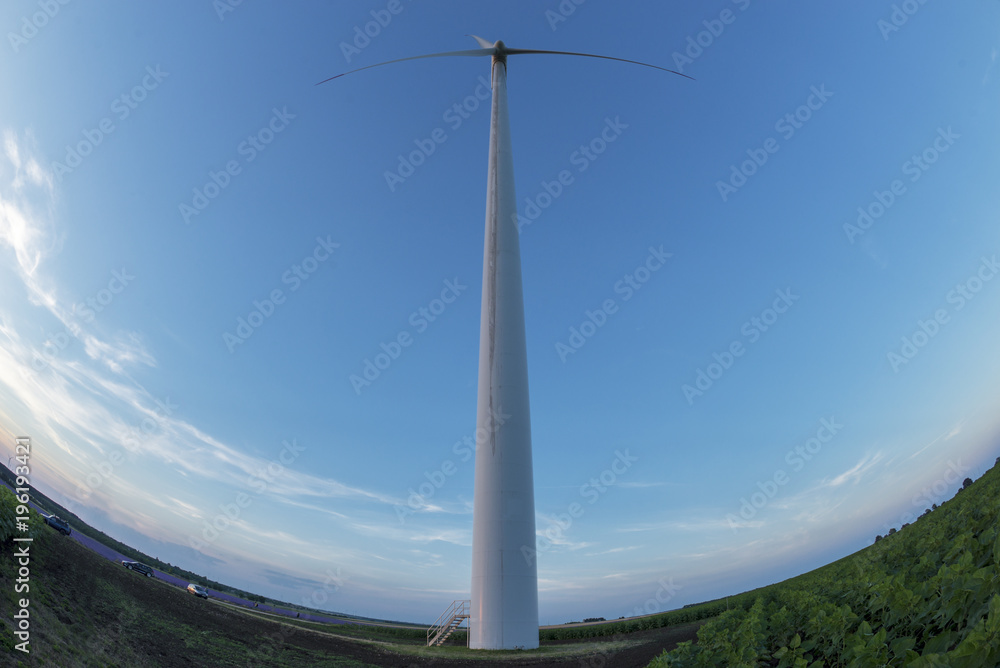 A fisheye shot of a wind turbine