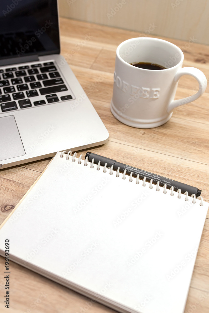 Laptop ,notebook ,pen and coffee on wood table Laptop ,notebook ,pen and coffee on wood table