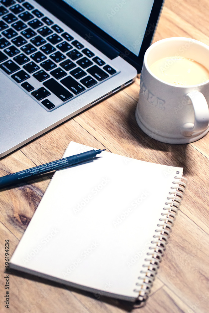 Laptop ,notebook ,pen and coffee on wood table Laptop ,notebook ,pen and coffee on wood table