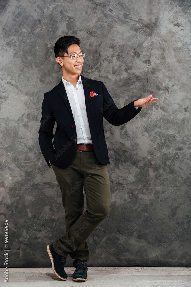 Full length portrait of a happy young asian man Full length portrait of a happy young asian man