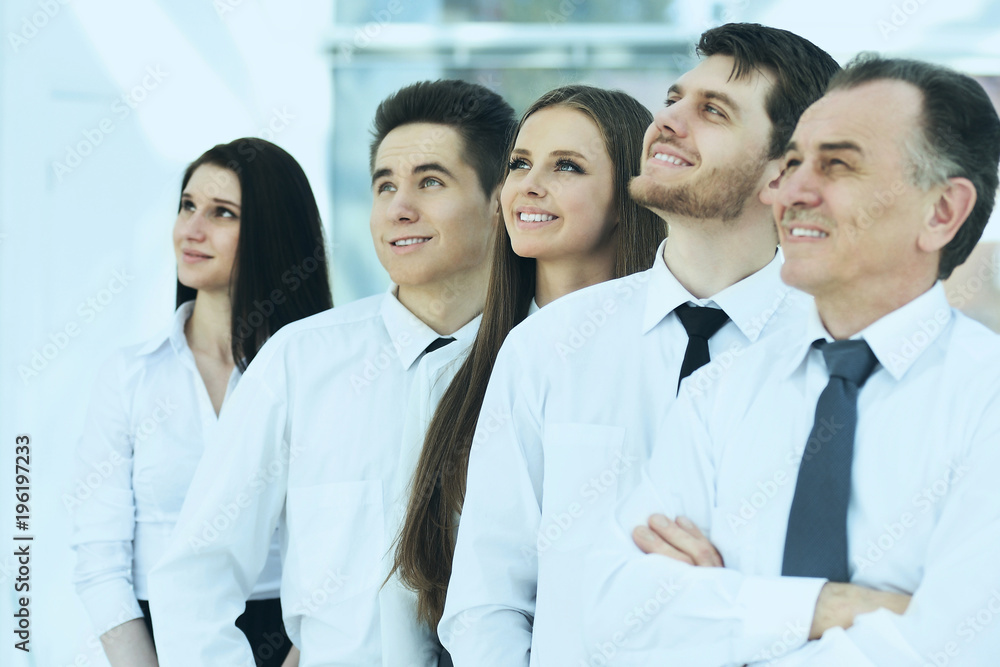 successful business team on a background of bright, modern offic successful business team on a background of bright, modern offic