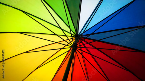 Seeing up a colorful rainbow umbrella
