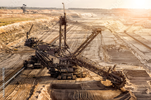 Obraz na płótnie Bucket-wheel excavator mining in a open pit brown coal mine.