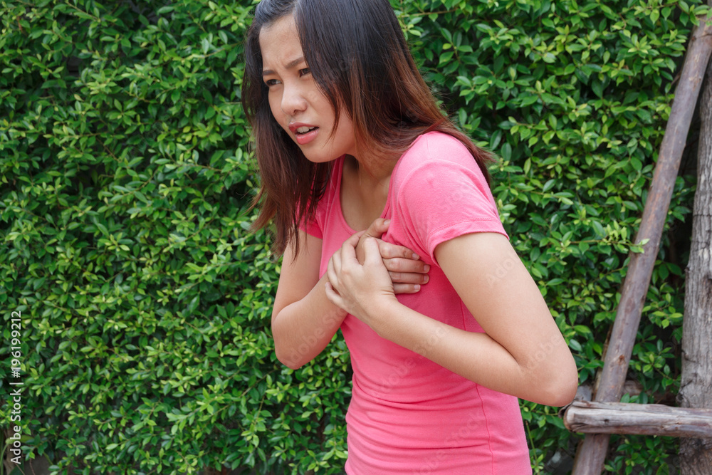 Sporty woman having heart attack - Angina Pectoris, Myocardial Infarction. Sporty woman having heart attack - Angina Pectoris, Myocardial Infarction.