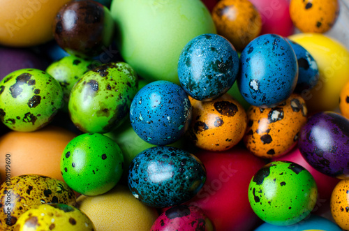 Easter eggs. Chicken and quail eggs painted in different colors for the celebration of Easter.