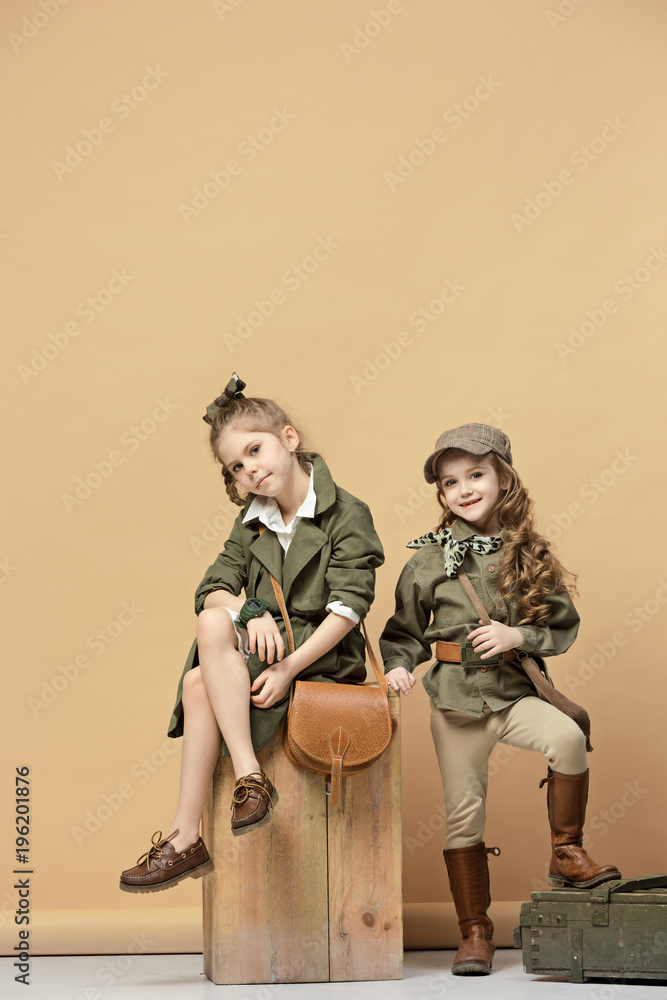 Two beautiful girls on a pastel background Two beautiful girls on a pastel background