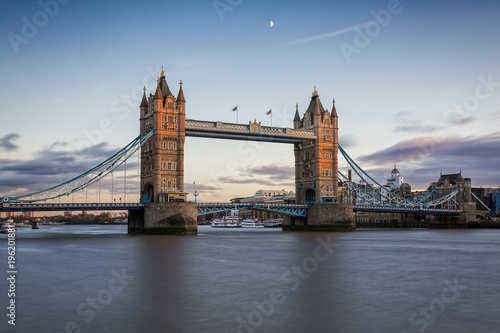 London s Tower Bridge at sunset with half moon