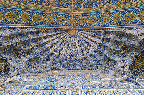 Details of the interior of the dome of the Sherdor Madrassah. Registan square in the center of Samarkand. This famous architectural complex was built from the XV to the XVII century.