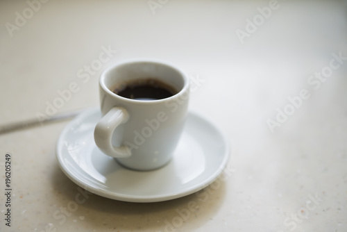 Morning Cup of coffee in a white Cup on a light background.