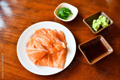 Salmon rare sashimi with wasabi and shoyu sauce 