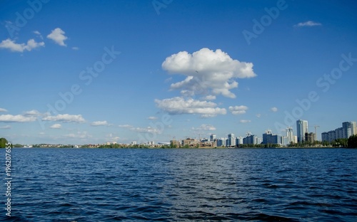  landscape of blue water against the background of a modern city. Minsk, Belarus .