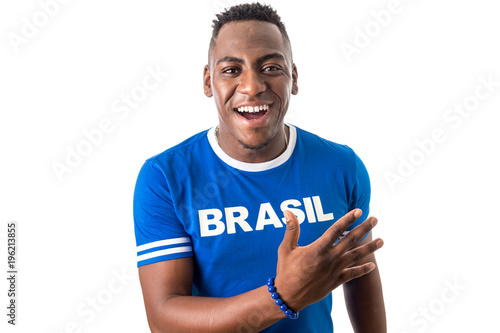 Brazilian man fan celebrating on footbal match on white background. Brazil colors.