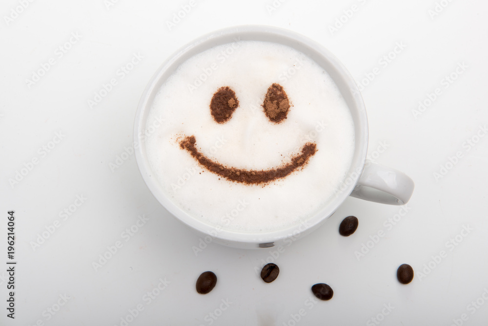 White cup of cappuccino with cinnamon smile on the white background White cup of cappuccino with cinnamon smile on the white background