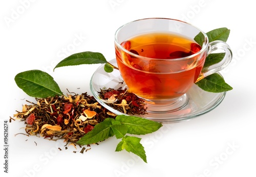 Cup of tea with tea leaves photo