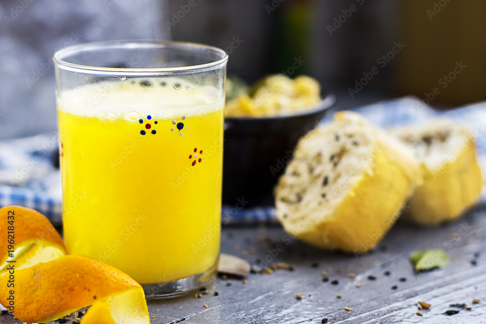 french homemade orange juice with gratin of potato and cheese and meat with sliced of bread french homemade orange juice with gratin of potato and cheese and meat with sliced of bread