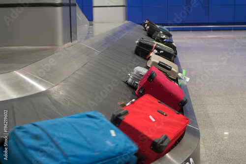 Baggage claim area in the airport abstract luggage line with many suitcases