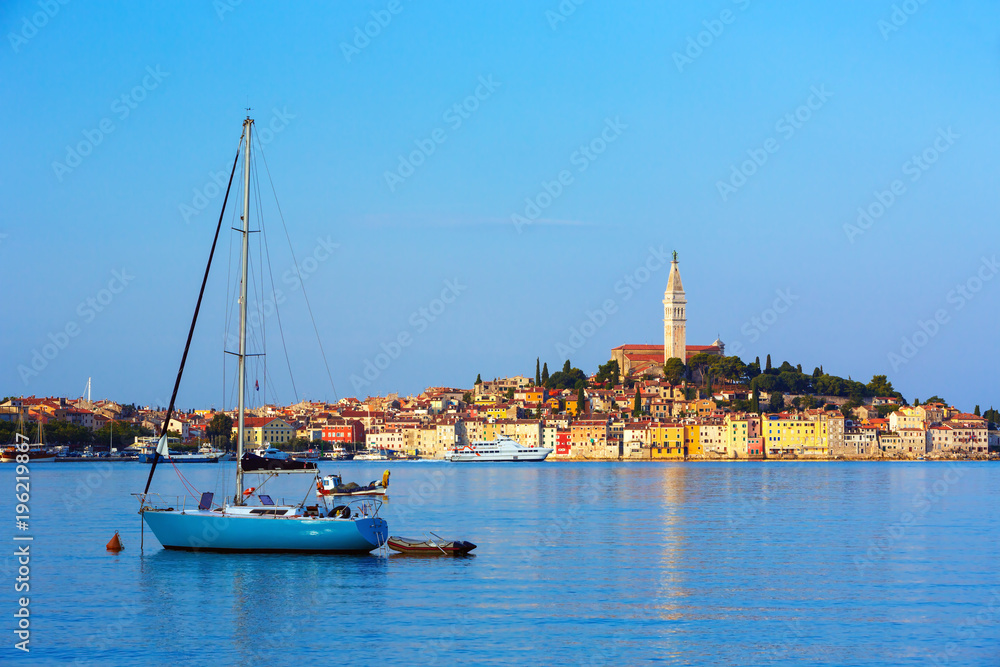  Sail boat enters the harbor of old Venetian town of Rovinj, Croatia