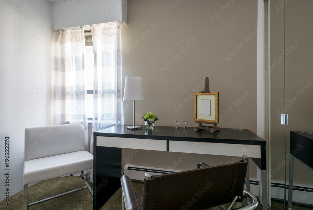 Modern bright home office interior with leather chair and desk. Modern bright home office interior with leather chair and desk.