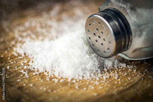 Salt on wooden background photo