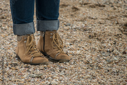 Boots on sandy beach