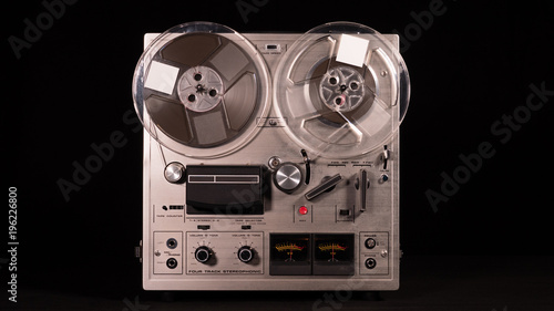 Vintage Reel to Reel tape recorder playing music 