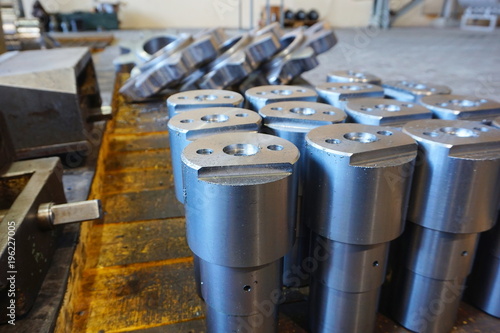 white metal cylindrical parts after machining on the milling and lathe