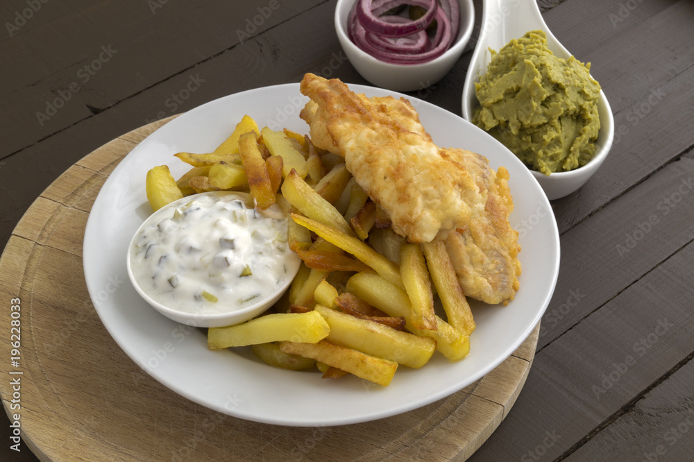 The fish and chips. A traditional English dish. The fish and chips. A traditional English dish.