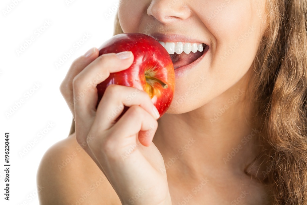 Closeup of a Young Woman Eating an Apple Closeup of a Young Woman Eating an Apple