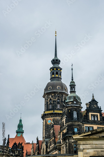 Spire of the clock tower at the royal palace in Dresden and the gloomy sky, Germany