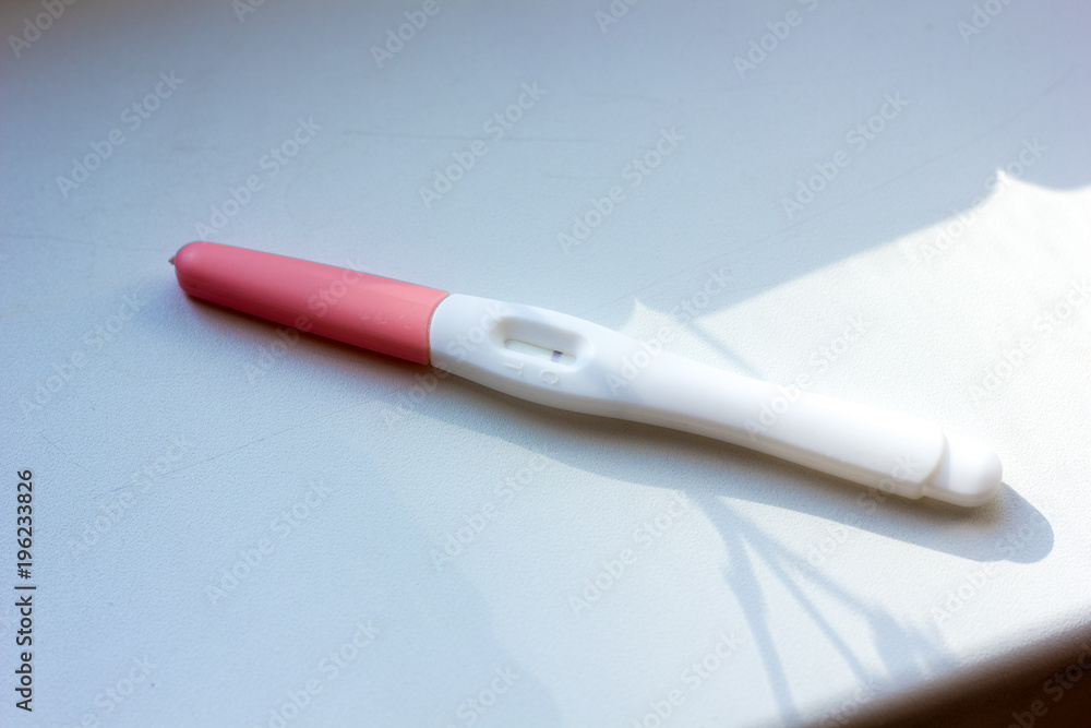Fototapeta premium Negative pregnancy test on white table.